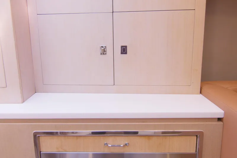 Quikwood Yacht Photos Pics Interior cabinetry of 2014 SACS Strider yacht, featuring light wood and sleek design.