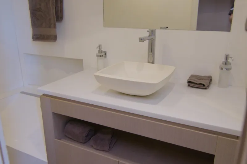 Quikwood Yacht Photos Pics Modern bathroom vanity on 2014 SACS Strider yacht with vessel sink and sleek fixtures.