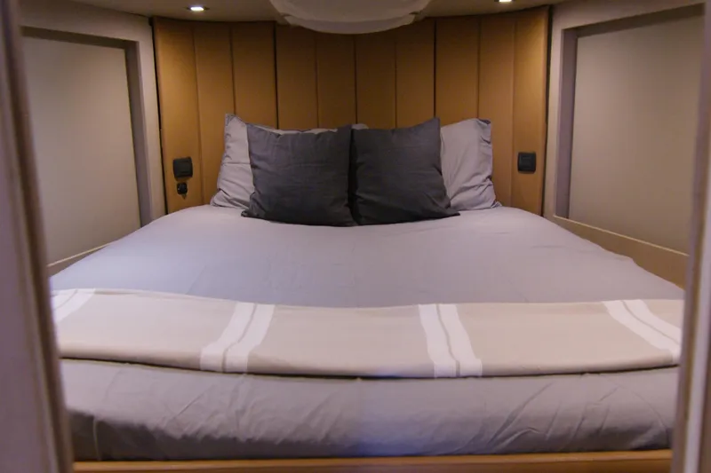 Quikwood Yacht Photos Pics Luxurious cabin interior of 2014 SACS Strider yacht with cozy bedding.