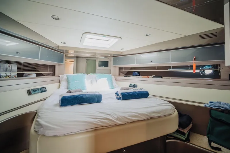  Yacht Photos Pics Luxurious cabin interior of 2015 Riva 52' Rivale yacht with cozy bedding.