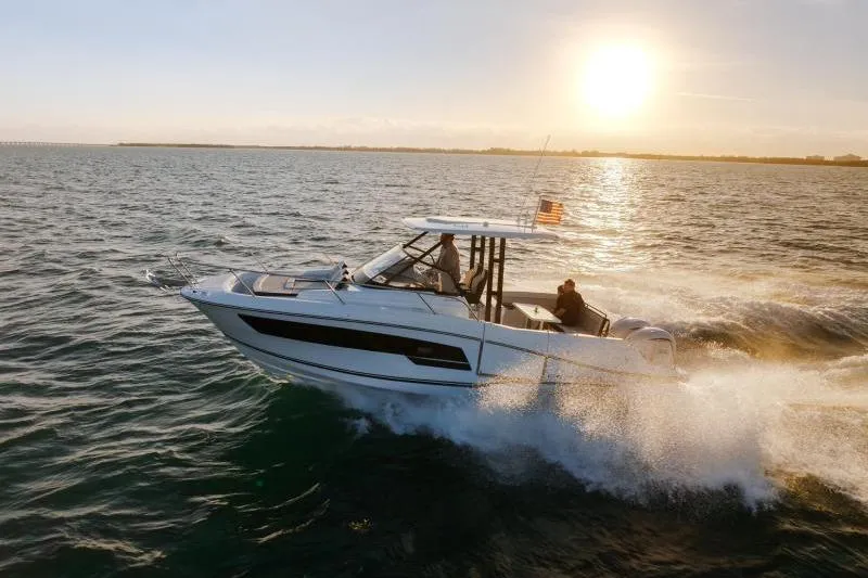  Yacht Photos Pics 2026 Jeanneau Leader 9.0 WA Series 2 cruising at sunset on open water.