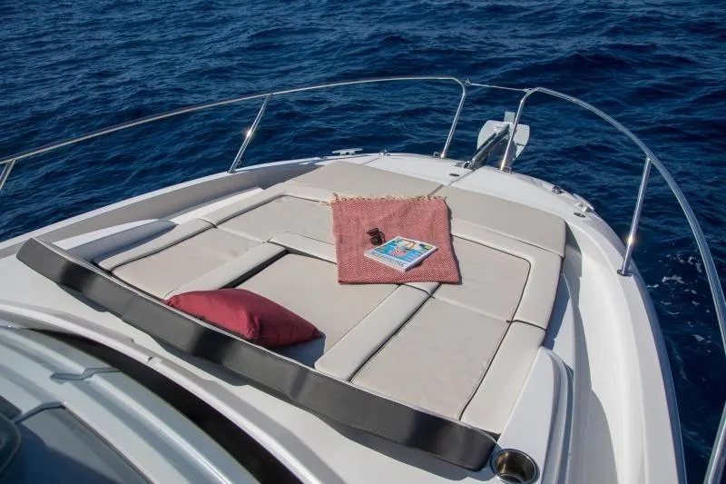  Yacht Photos Pics 2026 Jeanneau Leader 9.0 WA Series 2 boat with sunbathing deck on open sea.