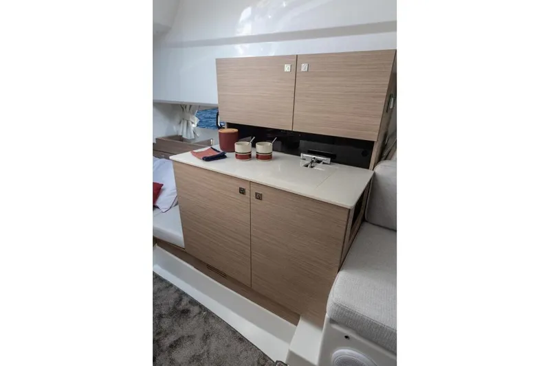  Yacht Photos Pics 2026 Jeanneau Leader 9.0 WA Series 2 interior with modern cabinetry and compact sink.