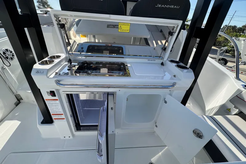  Yacht Photos Pics 2026 Jeanneau Leader 9.0 WA Series 2 boat kitchen with open fridge and stove.