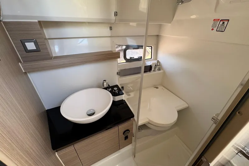  Yacht Photos Pics Modern bathroom in 2026 Jeanneau Leader 9.0 WA Series 2 boat, featuring sleek design.