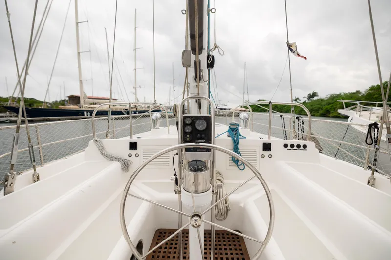  Yacht Photos Pics Steering wheel of 2009 Nordhavn 56 Motorsailer, docked with overcast sky.