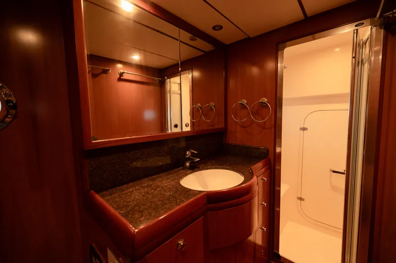  Yacht Photos Pics Luxurious bathroom in 2009 Nordhavn 56 Motorsailer with wood cabinetry and modern fixtures.