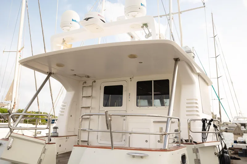  Yacht Photos Pics Nordhavn 56 Motorsailer 2009, rear view at marina, showcasing deck and cabin features.