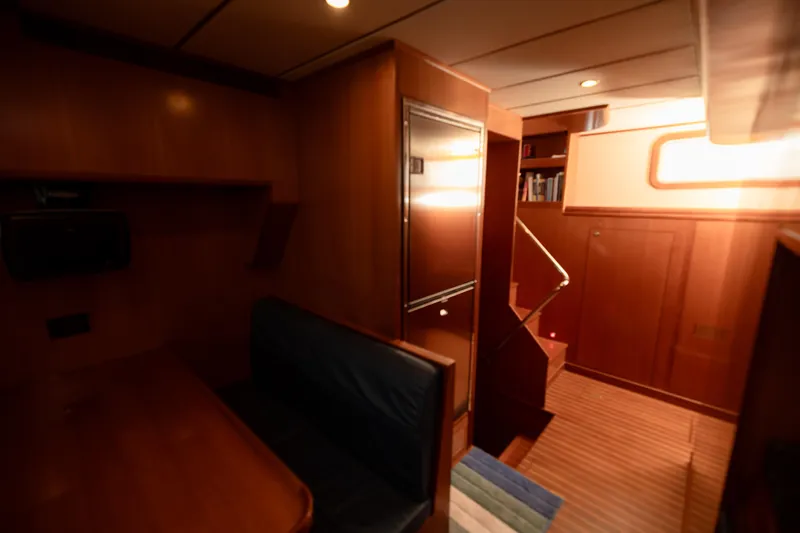  Yacht Photos Pics Interior of 2009 Nordhavn 56 Motorsailer with wood paneling and seating area.