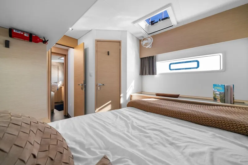 Halcyon Yacht Photos Pics 2024 Fountaine Pajot Aura 51 Catamaran cabin interior with modern design and natural light.