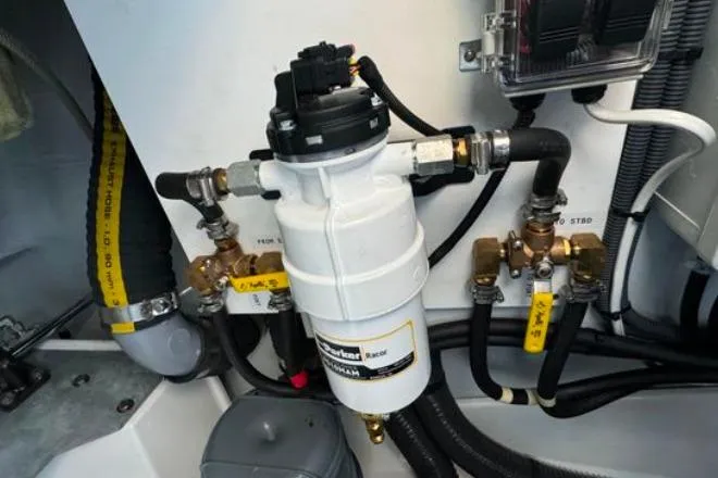 Halcyon Yacht Photos Pics Engine compartment of 2024 Fountaine Pajot Aura 51 Catamaran, featuring fuel filter and hoses.