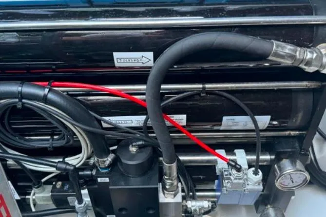 Halcyon Yacht Photos Pics Engine components of a 2024 Fountaine Pajot Aura 51 Catamaran, featuring hoses and gauges.