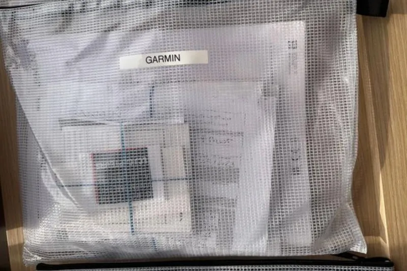 Halcyon Yacht Photos Pics Mesh bag containing Garmin documents for 2024 Fountaine Pajot Aura 51 Catamaran.