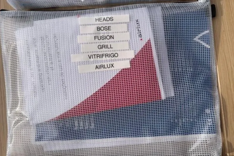 Halcyon Yacht Photos Pics Mesh bag with labeled documents for Fountaine Pajot Aura 51 Catamaran, 2024 model.