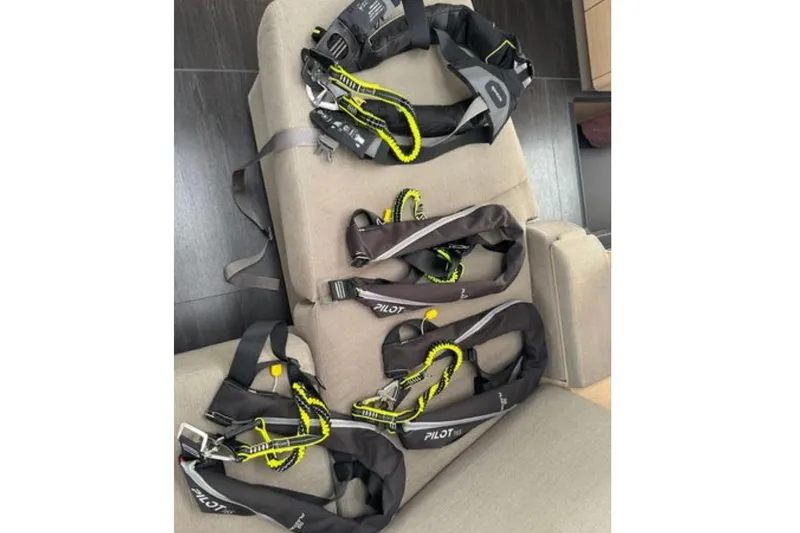 Halcyon Yacht Photos Pics Safety harnesses on a 2024 Fountaine Pajot Aura 51 Catamaran interior.