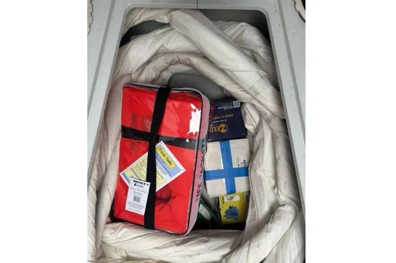 Halcyon Yacht Photos Pics Storage compartment on 2024 Fountaine Pajot Aura 51 Catamaran with safety gear and supplies.