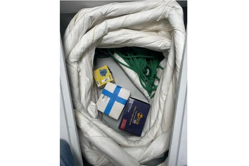 Halcyon Yacht Photos Pics Storage compartment with coiled rope and boxes on a 2024 Fountaine Pajot Aura 51 Catamaran.