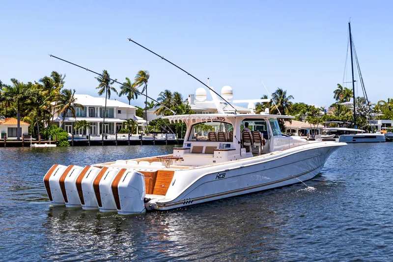 Book Ends Yacht Photos Pics 2021 HCB Estrella boat with multiple engines on a sunny waterfront.