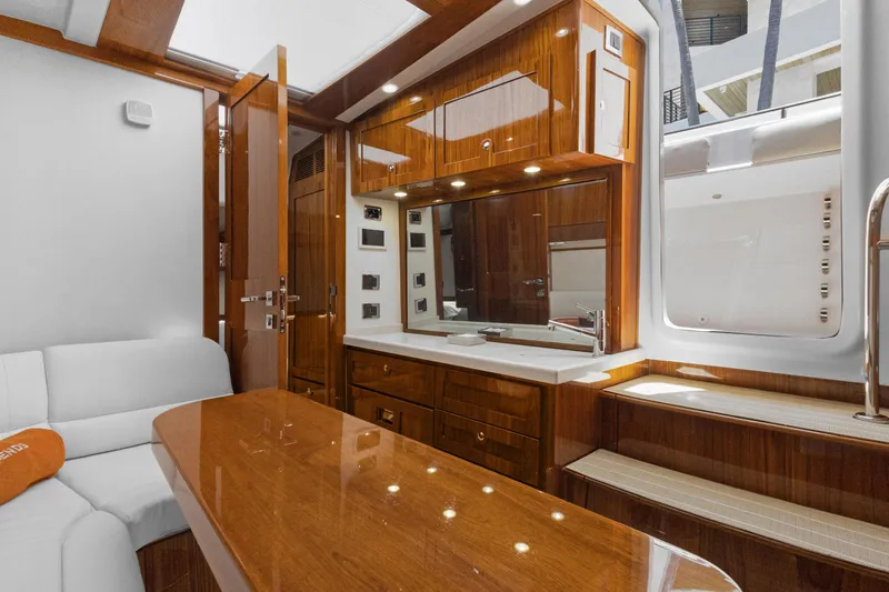 Book Ends Yacht Photos Pics Luxurious interior of 2021 HCB Estrella yacht with polished wood and modern amenities.