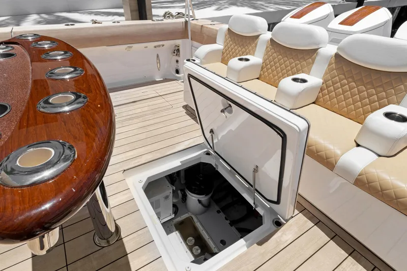 Book Ends Yacht Photos Pics Luxury HCB Estrella 2021 yacht interior with seating and open storage compartment.