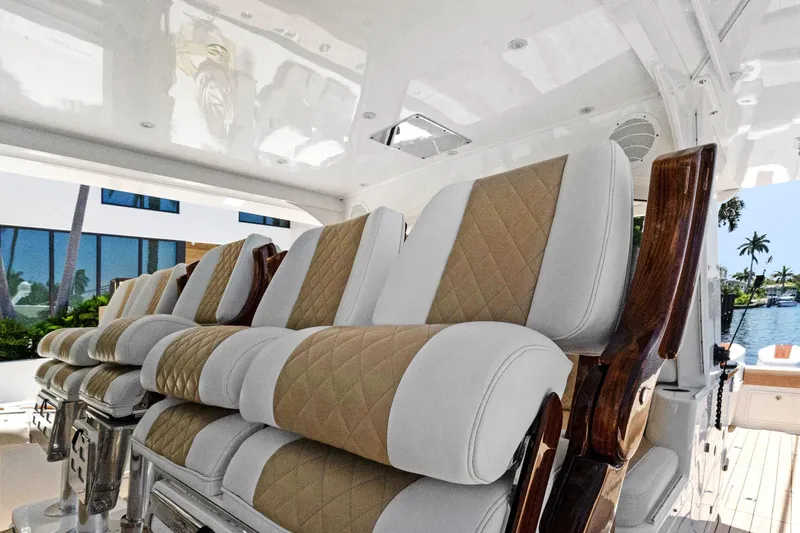 Book Ends Yacht Photos Pics Luxurious seating on 2021 HCB Estrella boat, featuring elegant tan and white upholstery.