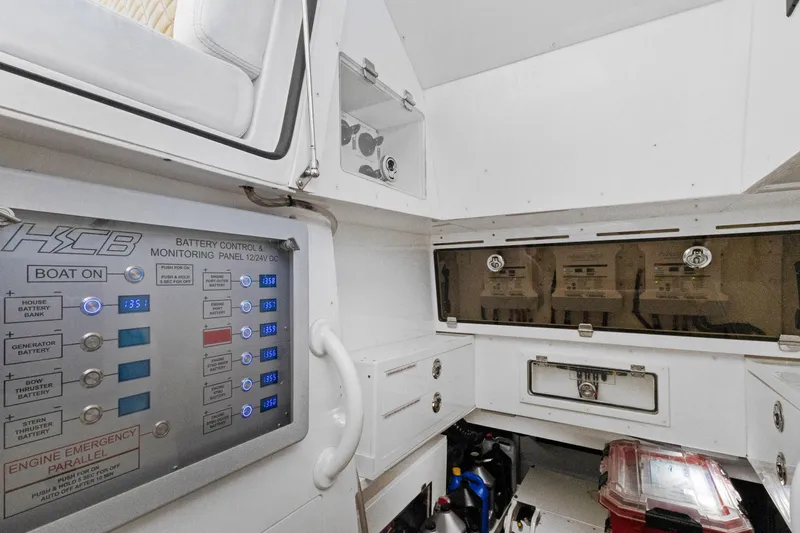 Book Ends Yacht Photos Pics Battery control panel in 2021 HCB Estrella boat, featuring monitoring systems and storage compartments.