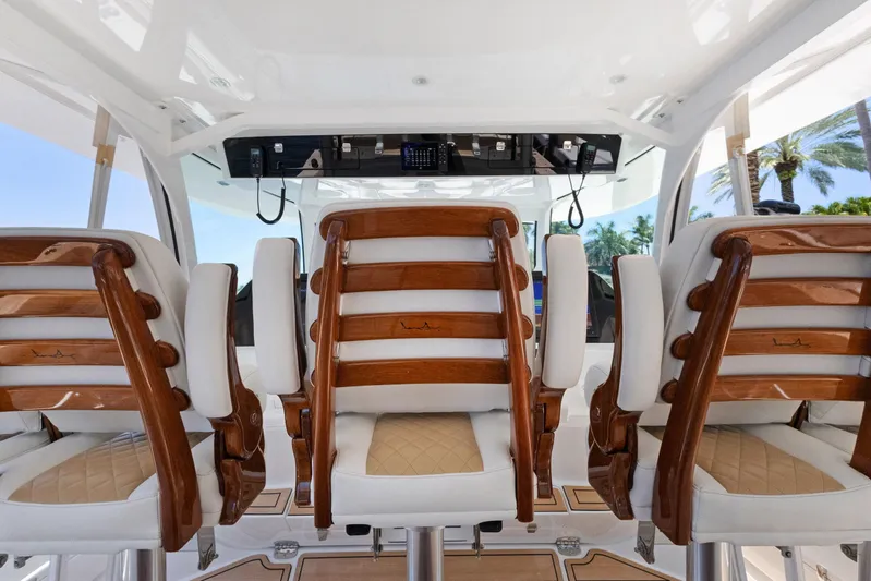 Book Ends Yacht Photos Pics Luxury seating on 2021 HCB Estrella boat with elegant wood and leather design.