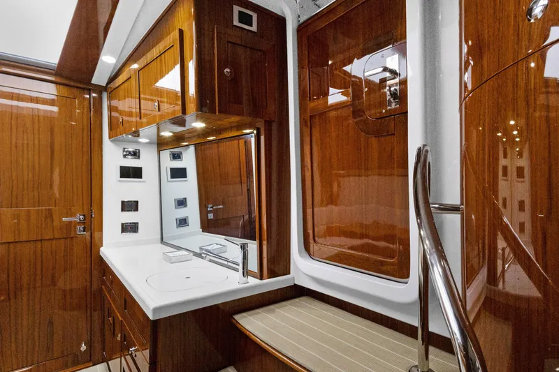 Book Ends Yacht Photos Pics Luxurious 2021 HCB Estrella yacht interior with polished wood and modern amenities.