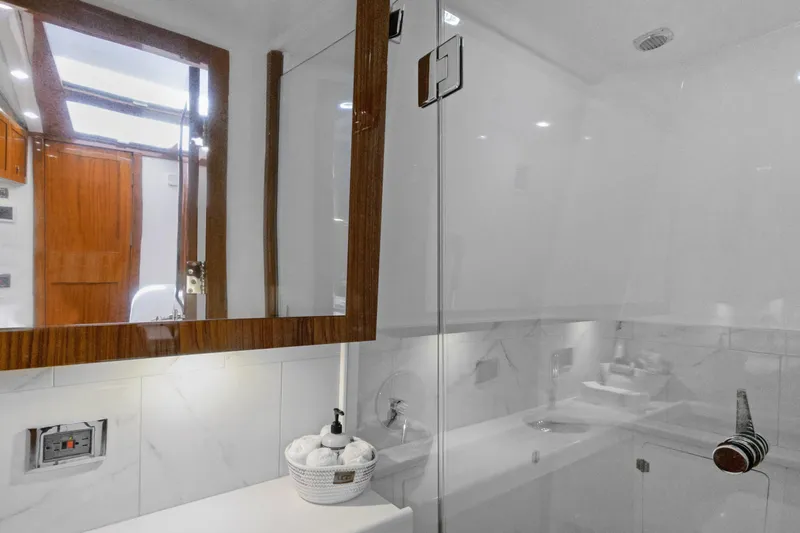 Book Ends Yacht Photos Pics Luxurious bathroom interior on 2021 HCB Estrella yacht with wood accents and modern fixtures.