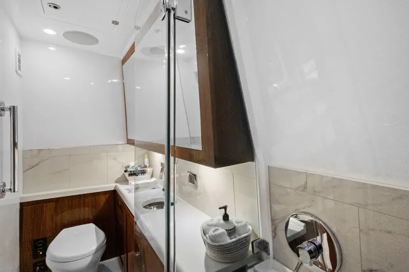 Book Ends Yacht Photos Pics Luxurious bathroom interior of 2021 HCB Estrella yacht with modern fixtures and elegant design.