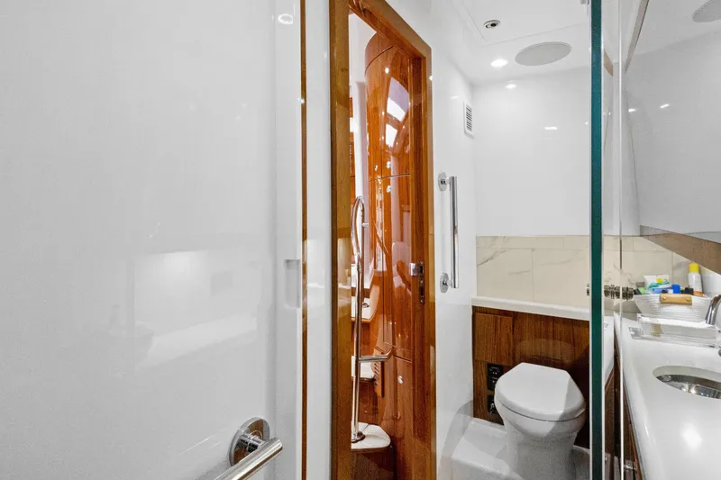 Book Ends Yacht Photos Pics Luxurious bathroom interior on 2021 HCB Estrella yacht, featuring modern fixtures and elegant wood accents.