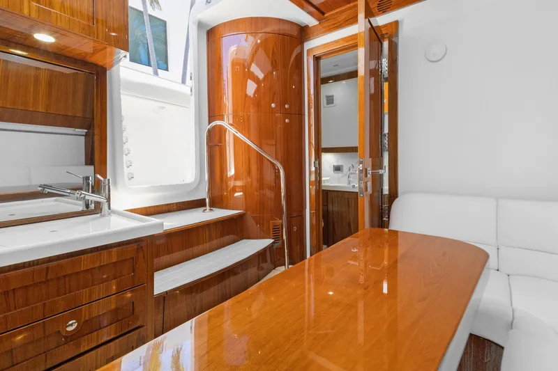 Book Ends Yacht Photos Pics Luxurious 2021 HCB Estrella yacht interior with polished wood and modern amenities.