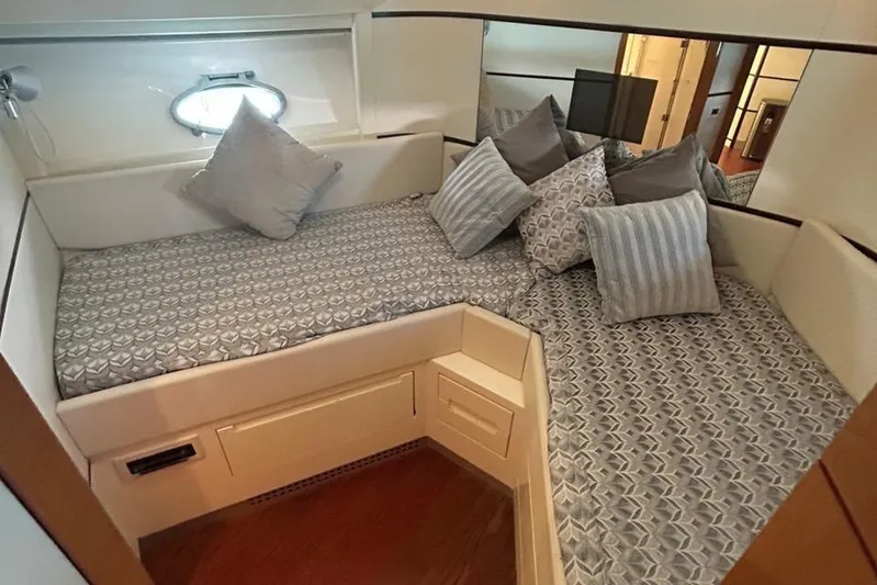  Yacht Photos Pics Luxurious cabin interior of a 2007 Pershing 62 yacht with stylish bedding and cushions.