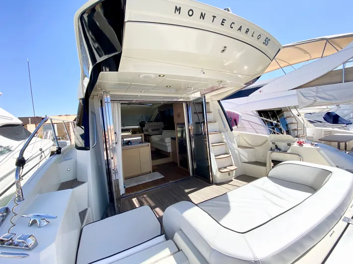 Revenant Yacht Photos Pics Luxury Monte Carlo MC5S yacht, 2015 model, featuring spacious deck and elegant interior.