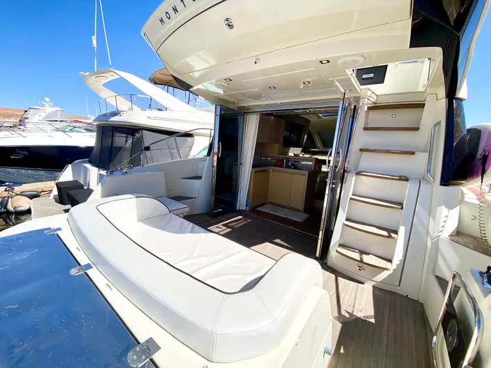 Revenant Yacht Photos Pics Luxurious 2015 Monte Carlo MC5S yacht interior with open deck and modern amenities.