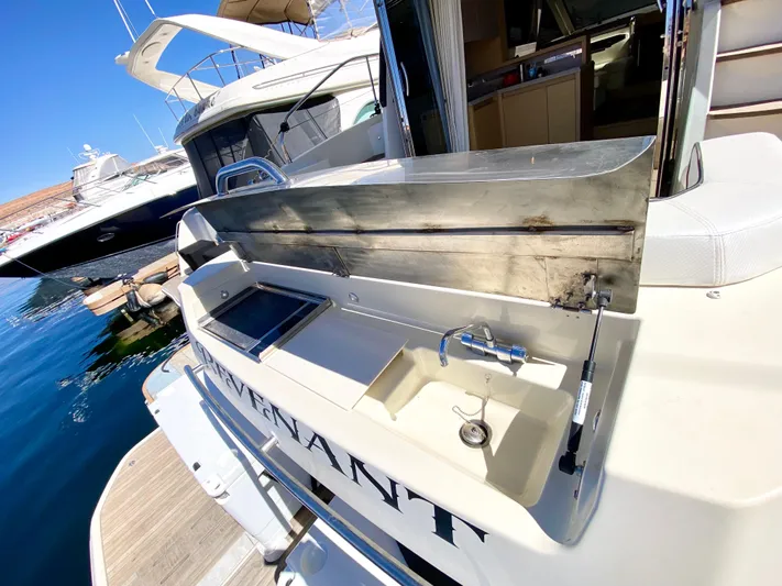 Revenant Yacht Photos Pics Luxury Monte Carlo MC5S yacht with outdoor sink and grill, docked at marina, 2015 model.