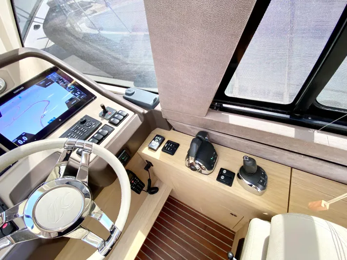 Revenant Yacht Photos Pics Cockpit of 2015 Monte Carlo MC5S yacht with modern controls and navigation system.