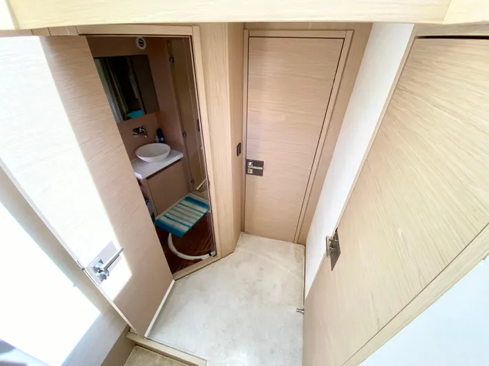 Revenant Yacht Photos Pics Modern bathroom interior in 2015 Monte Carlo MC5S yacht, featuring sleek design and light wood finishes.