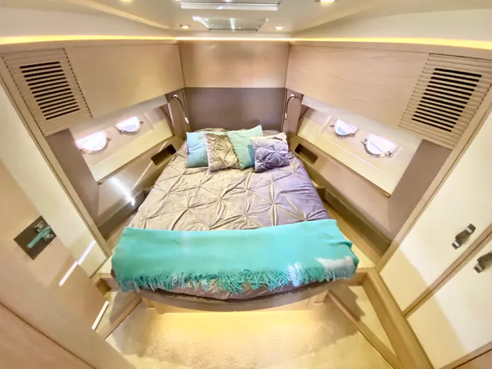 Revenant Yacht Photos Pics Luxurious 2015 Monte Carlo MC5S yacht bedroom with elegant bedding and ambient lighting.