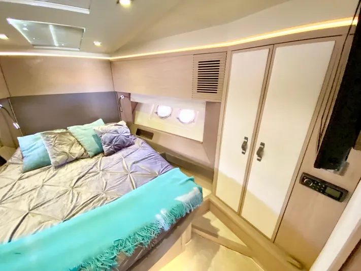 Revenant Yacht Photos Pics Luxurious 2015 Monte Carlo MC5S yacht bedroom with modern design and cozy bedding.
