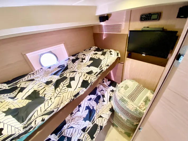 Revenant Yacht Photos Pics Cozy cabin interior of 2015 Monte Carlo MC5S with bunk beds and porthole window.