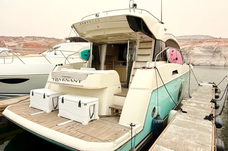 Revenant Yacht Photos Pics 2015 Monte Carlo MC5S yacht docked, featuring spacious deck and modern design.