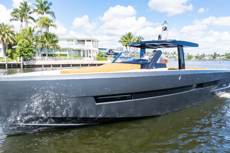  Yacht Photos Pics 2020 Fjord 44 Open yacht cruising on a sunny day, with palm trees in the background.