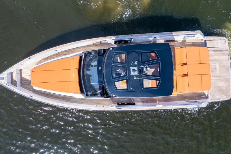  Yacht Photos Pics Aerial view of 2020 Fjord 44 Open yacht with orange seating on water.