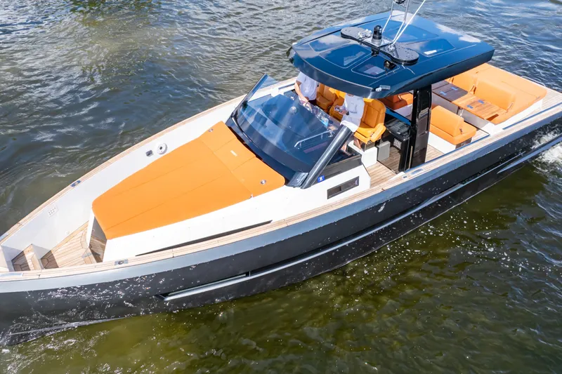  Yacht Photos Pics 2020 Fjord 44 Open yacht with sleek design and vibrant orange seating on the water.