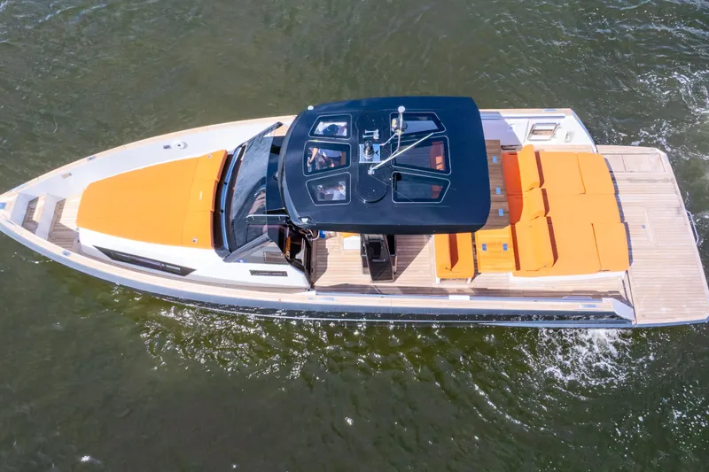  Yacht Photos Pics Aerial view of 2020 Fjord 44 Open yacht with orange seating on water.
