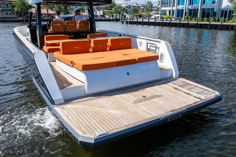  Yacht Photos Pics 2020 Fjord 44 Open yacht with orange seating, cruising on a sunny day.