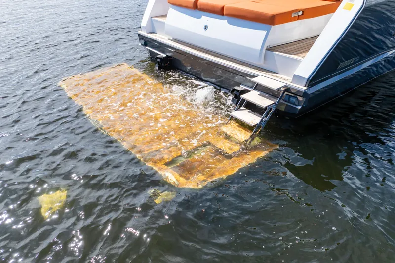  Yacht Photos Pics 2020 Fjord 44 Open yacht with swim platform and ladder in water.