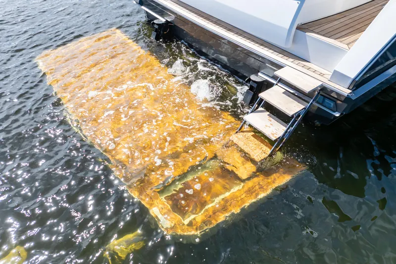  Yacht Photos Pics Stern view of 2020 Fjord 44 Open yacht with swim platform and ladder.