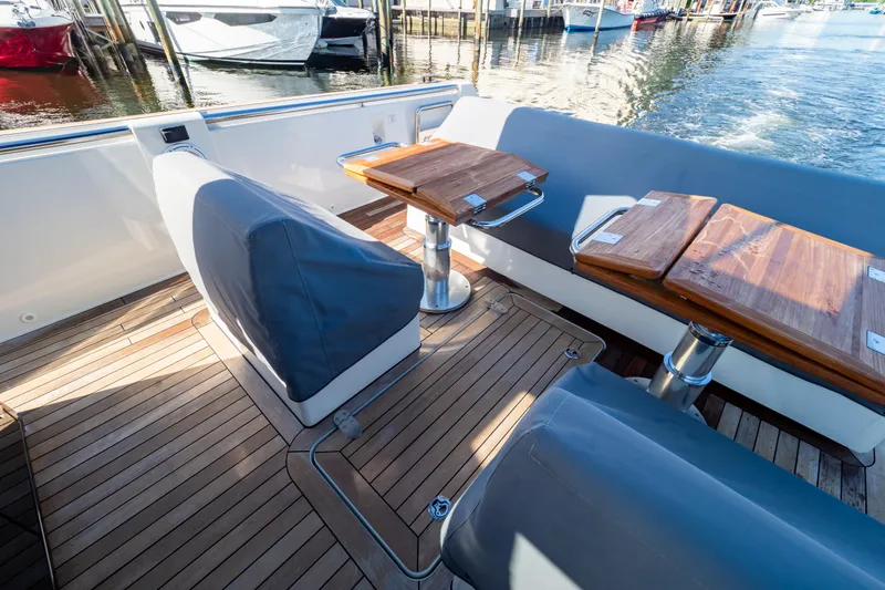  Yacht Photos Pics Luxurious 2020 Fjord 44 Open yacht interior with wooden deck and seating area.